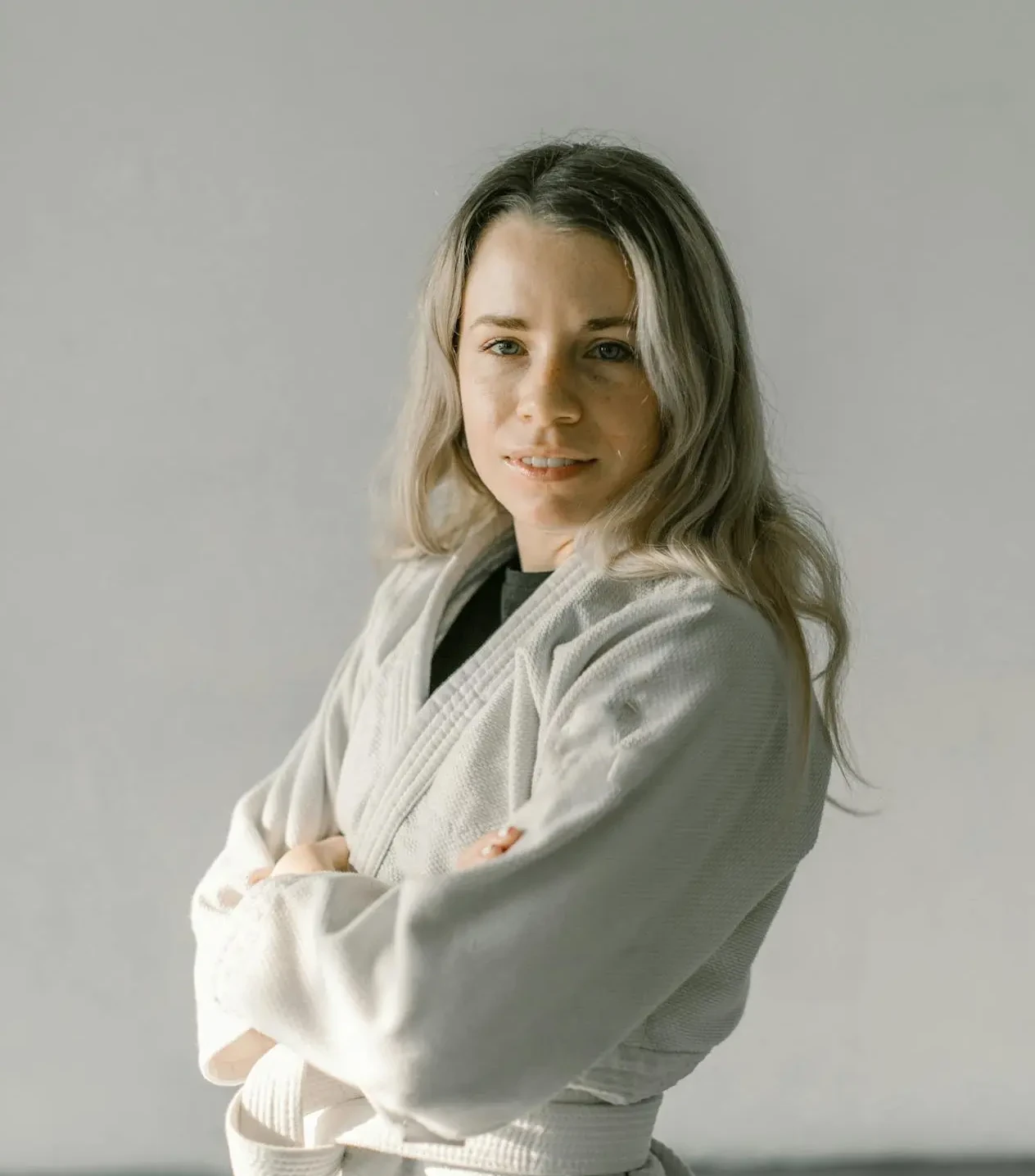 A female judoka folding her arms