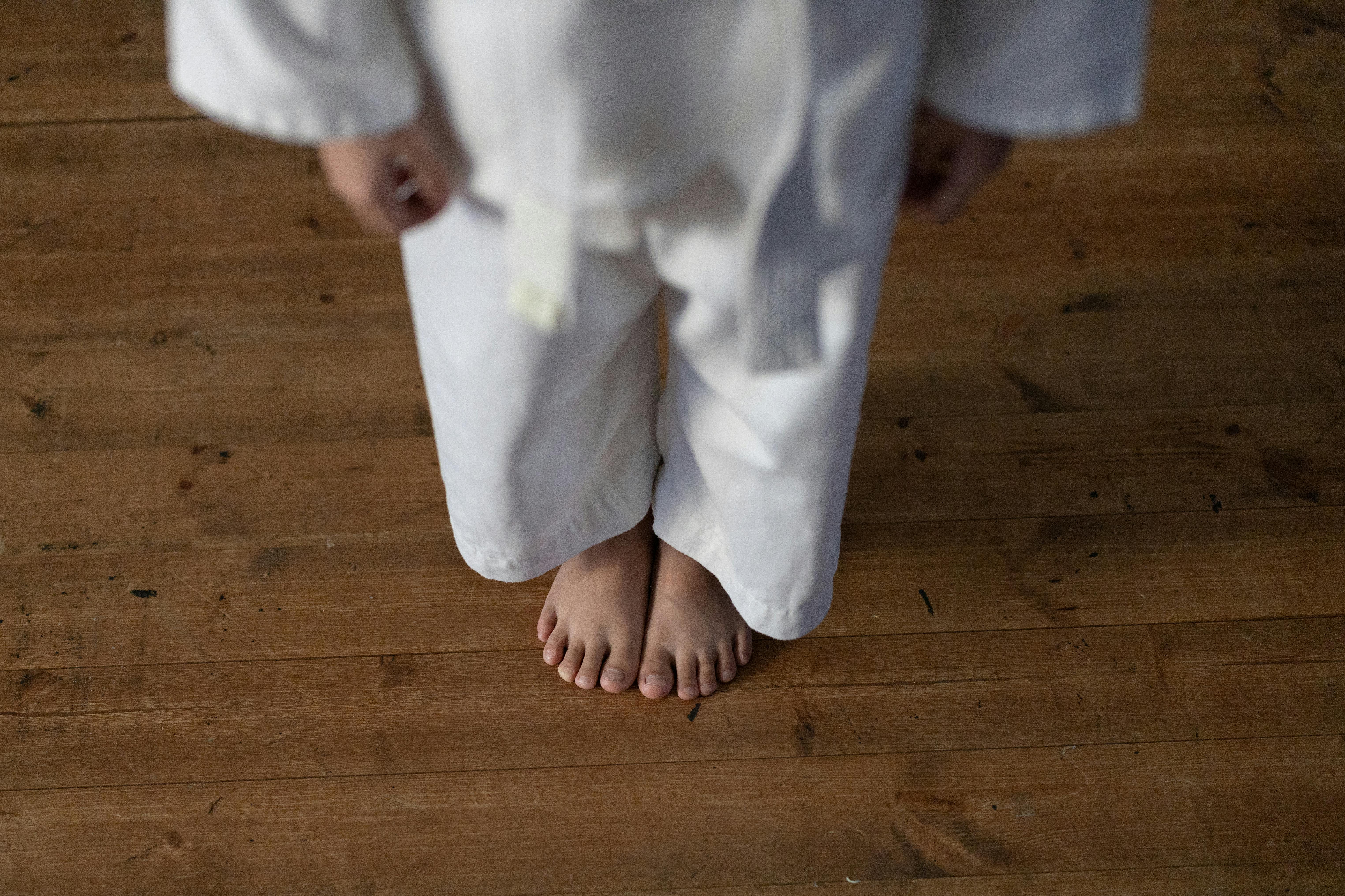 A judoka standing respectfully